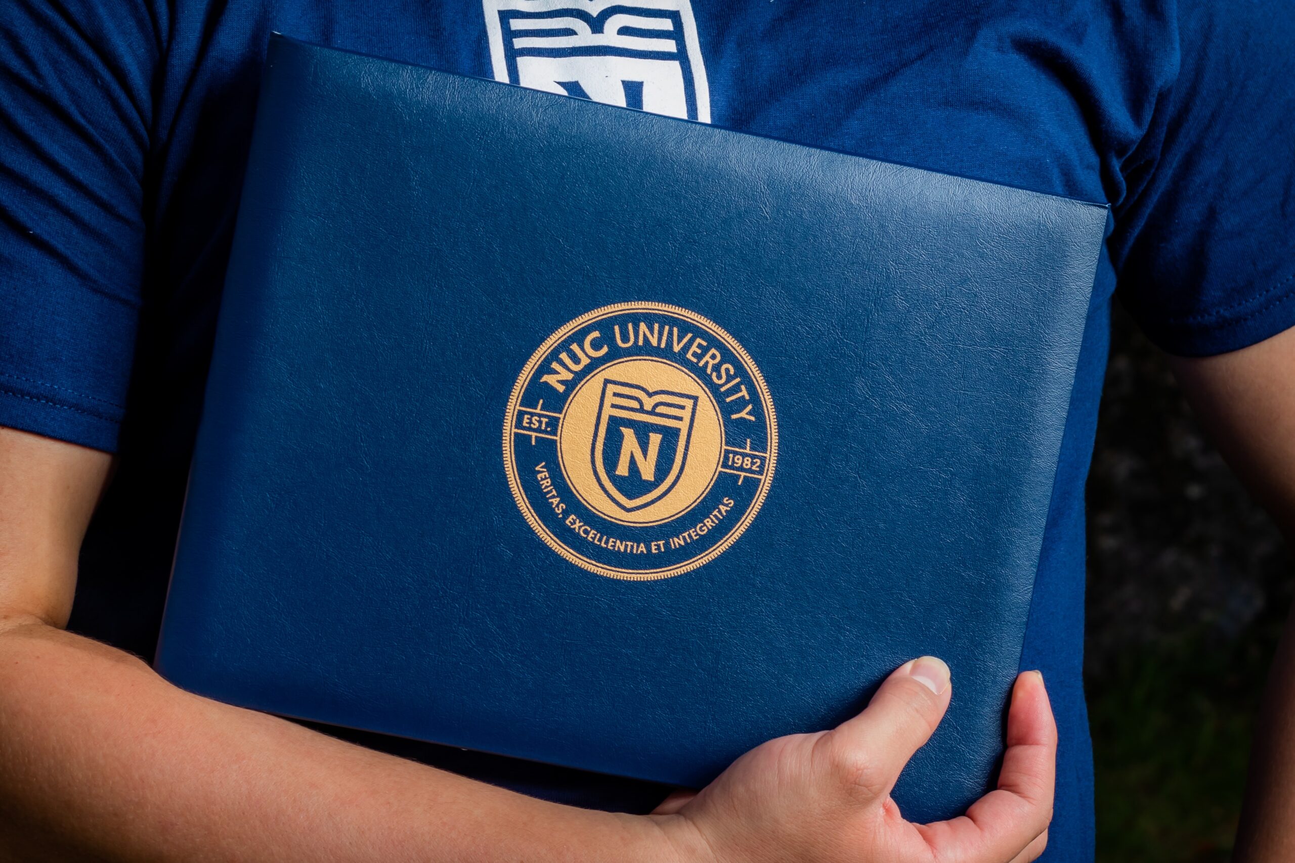 Person holding diploma