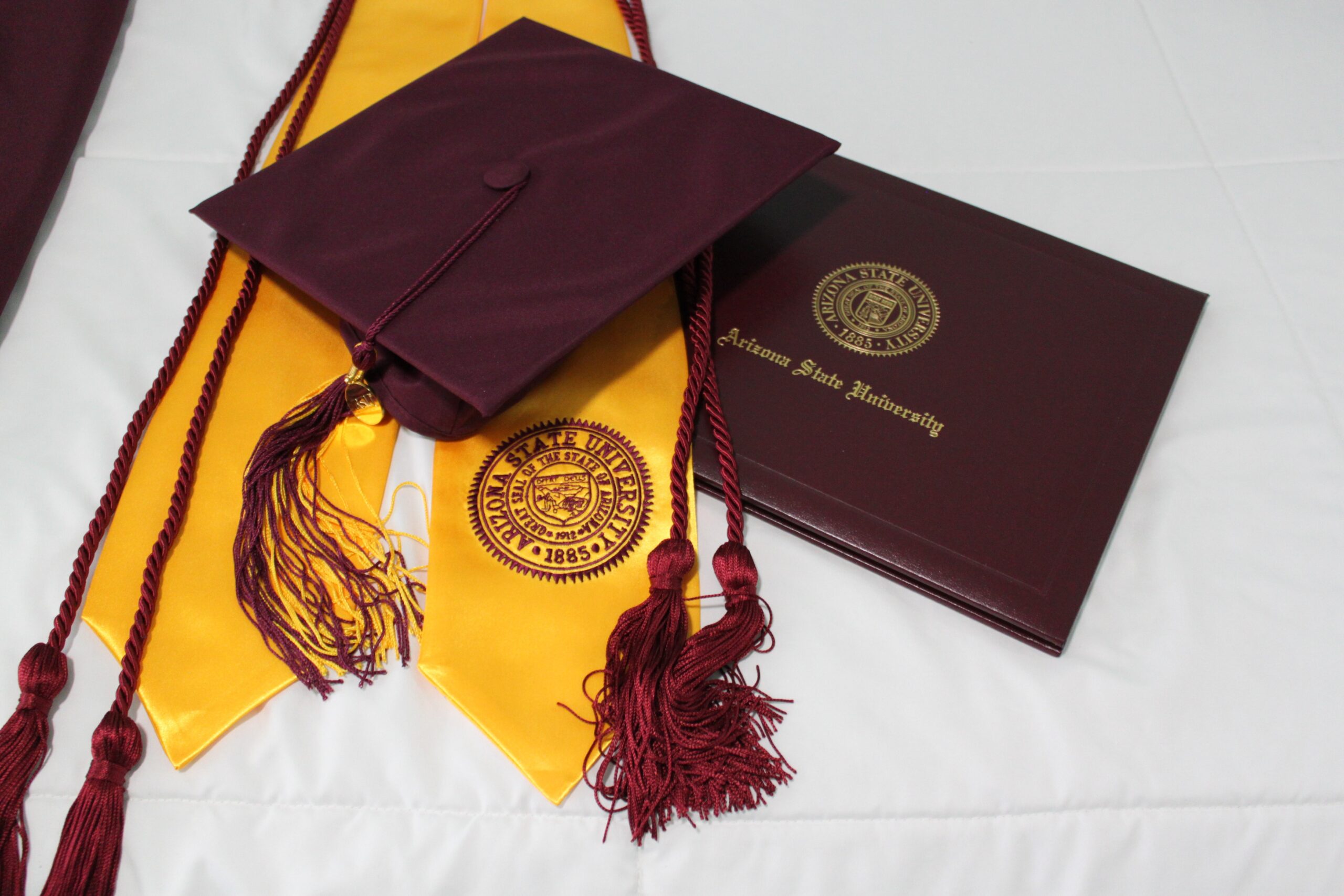 University diploma, tassel and stole