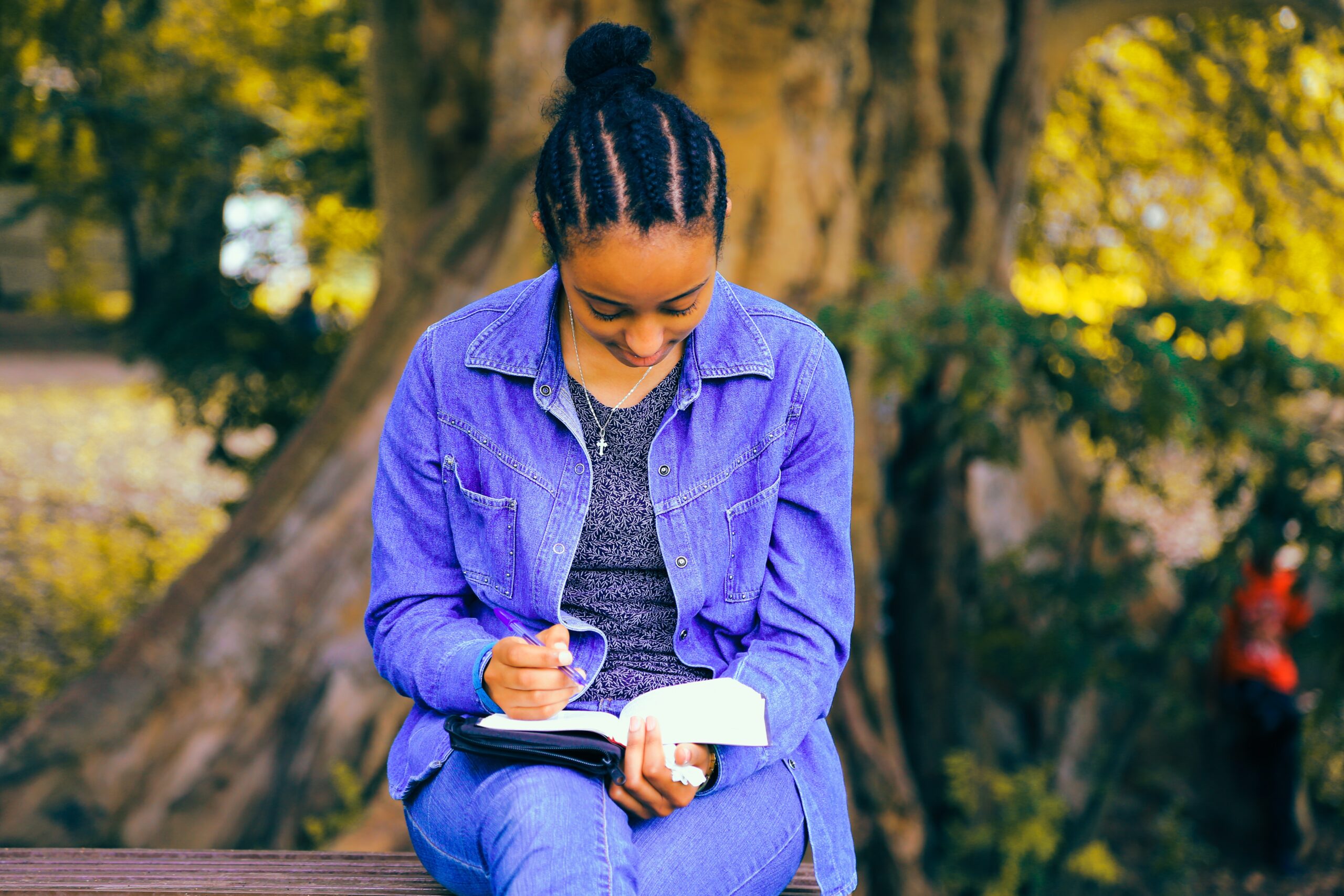 Woman reading under a tree